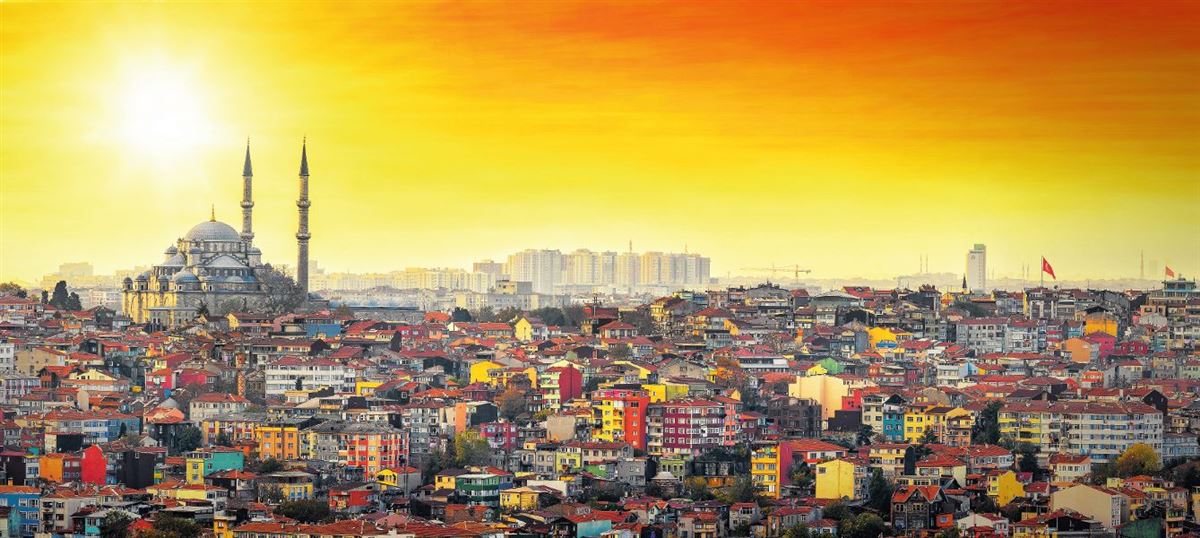 Istanbul Mosque with colorful residential area in sunset